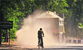 A truck spills sand on a road on the PAU campus in Ludhiana. 