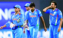 Indias captain Mahendra Singh Dhoni (L) leads his men off the field after they won their Twenty20 World Cup Super Eight match against South Africa in Colombo on Tuesday
