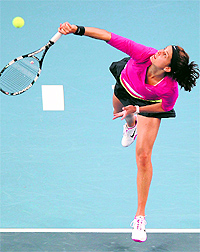 Julia Georges serves to Samantha Stosur in Beijing on Tuesday