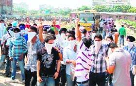 Students of Khalsa College of Engineering and Technology raise slogans against the principal and college management in Amritsar on Wednesday