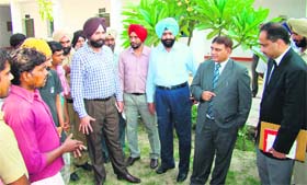 Kishore Kumar, District Sessions Judge (2nd from right) interacts with jail inmates after launching the free legal aid service at Amritsar Centrel Jail on Wednesday