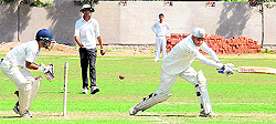 A batsman strikes a ball during an inter-school cricket match at the LIC ground in Sector 26, Chandigarh, on Wednesday