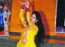 A contestant of the Uttarakhand Princess Contest shows her dance talent during a sub-event in Dehradun on Wednesday. 
