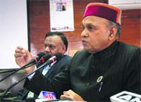 Chief Minister PK Dhumal addresses mediapersons in Shimla on Wednesday.