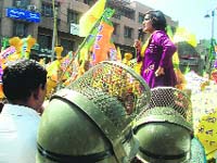 Kusum Sharma, President of the HJC Womens wing, addresses a meeting near the CMs residence in Rohtak on Wednesday in protest against the spurt in crime against women.