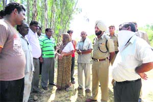 DSP Surjeet Singh Chahal interacts with the deceaseds kin in Pipli on Wednesday.