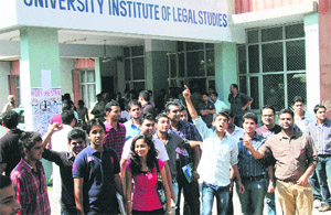 Students of the University Institute of Legal Studies protest in front of their department in Chandigarh on Thursday. 