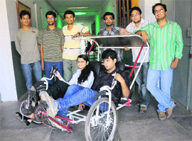 Students of the University Institute of Engineering and Technology with their environment friendly vehicle. 
