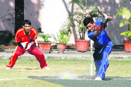 Players in action during the Rohitash Memorial Cricket Tournament in Dehradun on Thursday. 