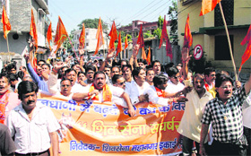 Activists of the Shiv Sena hold a demonstration in front of the District Magistrates office in Dehradun on Thursday against rising incidents of cow slaughter.