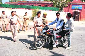 Women cops stop a motorcyclist outside the girls wing of Government College, Sirsa, on Thursday