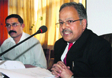 Deputy Commissioner Arun Sharma (right) addresses mediapersons in Shimla on Thursday.