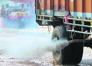Smoke from a truck adds to the air pollution in Jammu.