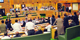 PDP, BJP and NPP legislators protest during the Assembly session in Srinagar on Thursday.