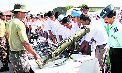 School children take a view of the exhibits on display during the 80th Air Force Day celebrations organised at the Adampur Air Force Station on Thursday