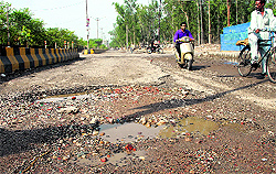 Damaged road leading to Gurunanak Pura Railway level crossing from Ladowali in Jalandhar;