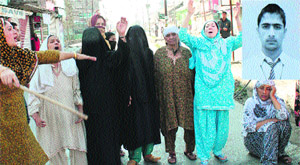 Relatives of the accused teenager protest against the police in Srinagar on Thursday.