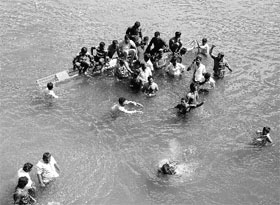 Farmers stage a protest in the waters of the KRS dam in Mysore.