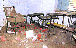 Debris of a collapsed roof lies on the furniture of a classroom at Government School, Budh Singh Wala, in Moga