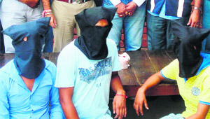 Wanted smuggler Bhupinder Singh and his accomplices in the police custody in Amritsar on Friday. 