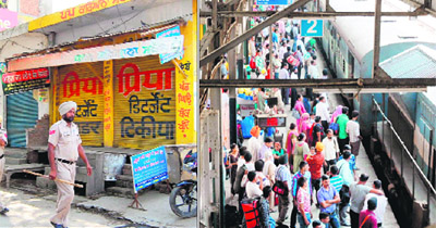 A view of closed shops at Attari. (Right) Passengers wait for the departure of Shan-e-Punjab train at Amritsar railway station on Friday.