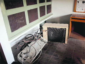 Non-functional air conditioners dumped in a corner of a room