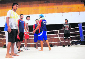 Supporters of boxer Khushdeep Singh come inside the ring in protest against the decision of the referees at Panjab University in Chandigarh on Friday.