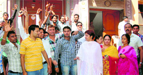 Supporters of a sadhvi and a saint of Gangeshwar Dham Aatmanand Ashram raise slogans in Haridwar on Friday.