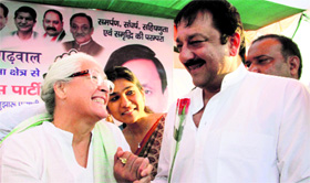 Cine star Sanjay Dutt being greeted by Nafisa Ali at a rally held in support of Congress candidate for the Tehri byelection Saket Bahuguna in Dehradun on Friday.