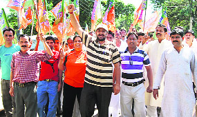 Supporters of Indora MLA Des Raj take out a rally at Dahkulara in Nurpur. 