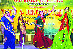 Students perform giddha during the zonal youth festival at Dakha on Friday