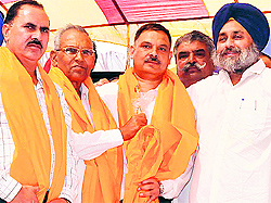 Sukhbir Badal welcomes BSP leaders into the SAD at a rally in Nawanshahr on Friday
