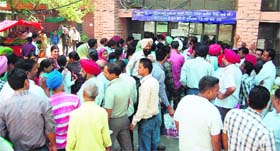 All for a token: People stand in long queues outside the revenue offices in Amritsar