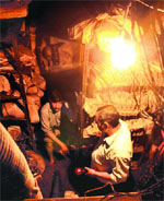 Firemen drain out water from the basement of the Bank of Baroda in Sector 22 on Saturday . Tribune photo: Pradeep Tewari