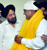 Shiromani Akali Dal (Badal) leader BS Ramuwalia felicitates Judge Navdeep Singh Bhatia (right) at a function in New Delhi on Saturday.