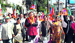 Mussoorie BJP MLA Ganesh Joshi seeks votes for party candidate for the Tehri bypoll Mala Raj Lakshmi in Mussoorie on Saturday