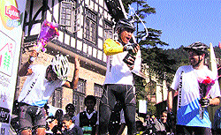 Winners of the Hercules MTB Himachal 2012 Narayan Gopal (centre), 1st runner-up Aayman Tamang and 2nd runner-up Richard McDowell celebrate their victory on the Ridge in Shimla on Saturday