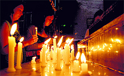 Tibetans hold a candlelight march at McLeodganj on Saturday