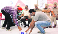 Taxi drivers participate in a workshop organised by the city police in Jalandhar on Saturday. 
