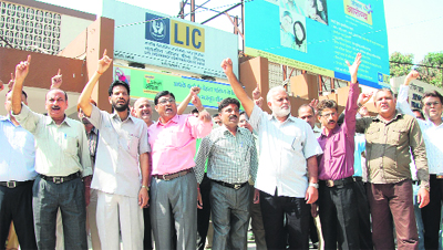 Members of the Northern Zone Insurance Employees Association protest against the governments decision of FDI in the pension and insurance sector in Jalandhar.