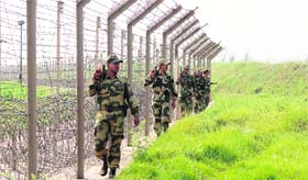 BSF soldiers patrol the International Border in Samba sector