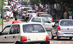 A traffic jam opposite the MC Zone-D Office at Sarabha Nagar in Ludhiana on Saturday