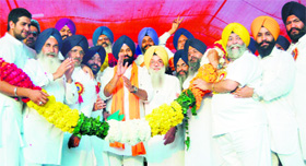 Shiromani Akali Dal leaders honour Punjab Cabinet minister Bikram Singh Majithia during a rally in Amritsar on Sunday.