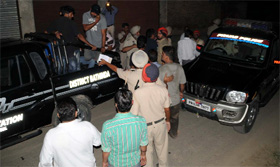 Policemen investigate at the crime spot in Balla Ram Nagar. Incidents of firing have instilled fear among the residents who now think twice before venturing out at night.