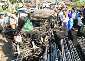 The mangled remains of the jeep that rammed into a truck loaded with iron rods on the Chandigarh-Ambala highway in Zirakpur on Sunday