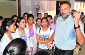 SSP Naunihal Singh interacts with girl students during an awareness drive against eve-teasing at Panjab University in Chandigarh