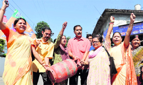 BJP workers hold a demonstration against the hike in the price of LPG cylinders in Dehradun on Sunday.