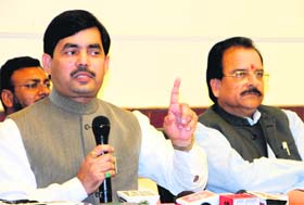 Shahnawaz Hussain, BJP national spokesperson and MP, addresses the media in Dehradun on Sunday