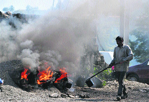 A labourer busy at a road construction site in Shimla on Sunday. 