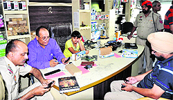 Police records the statement of showroom owner followng the burglary in Jalandhar on Sunday